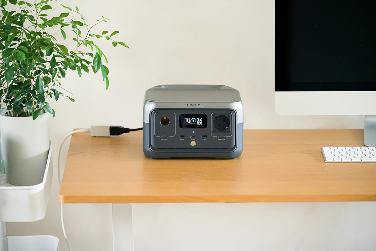 EF EcoFlow RIVER 2 portable power station being carried by handle